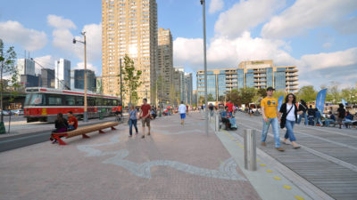 Queens Quey Toronto, with pedestrians and a streetcar